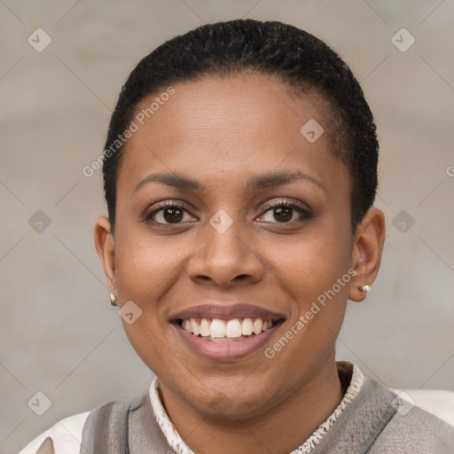 Joyful black young-adult female with short  brown hair and brown eyes