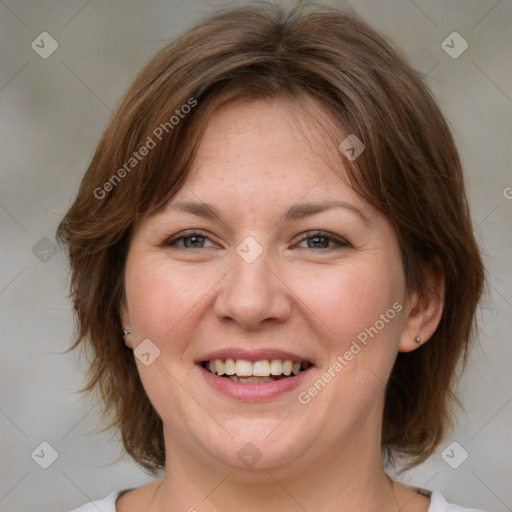 Joyful white adult female with medium  brown hair and grey eyes