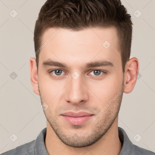 Neutral white young-adult male with short  brown hair and brown eyes