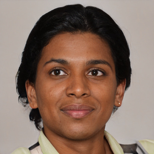 Joyful asian young-adult female with medium  black hair and brown eyes