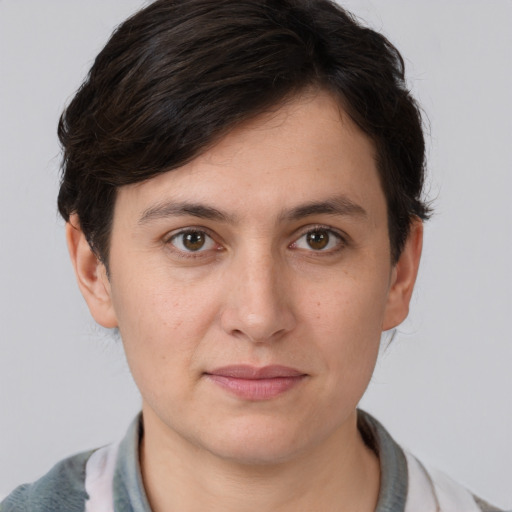 Joyful white young-adult female with short  brown hair and brown eyes