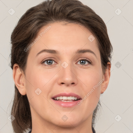 Joyful white young-adult female with medium  brown hair and green eyes