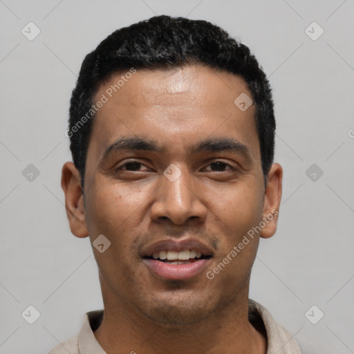 Joyful latino young-adult male with short  black hair and brown eyes