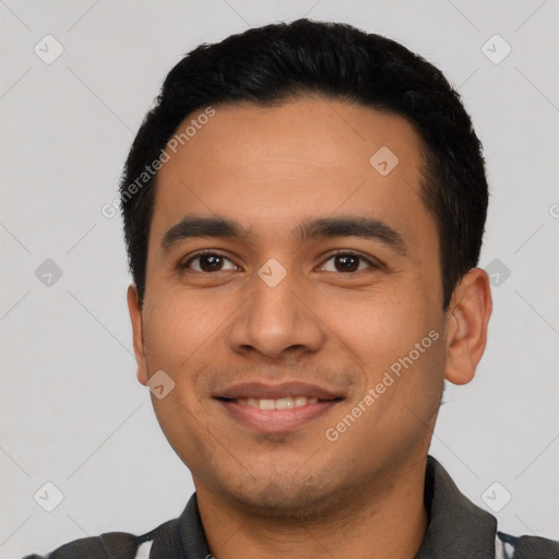 Joyful latino young-adult male with short  black hair and brown eyes