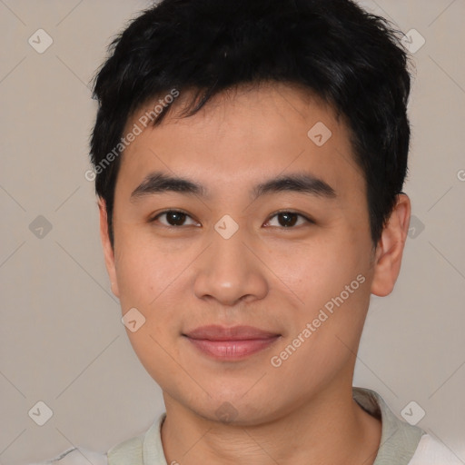 Joyful asian young-adult male with short  black hair and brown eyes