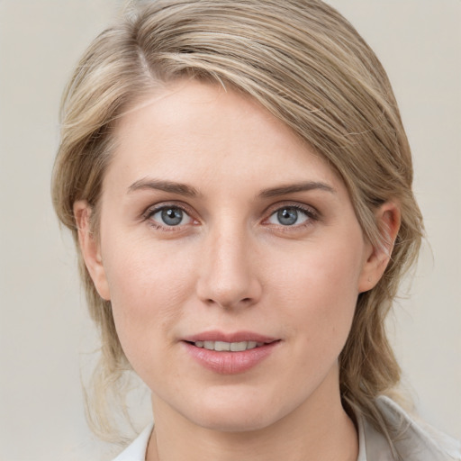 Joyful white young-adult female with medium  brown hair and blue eyes