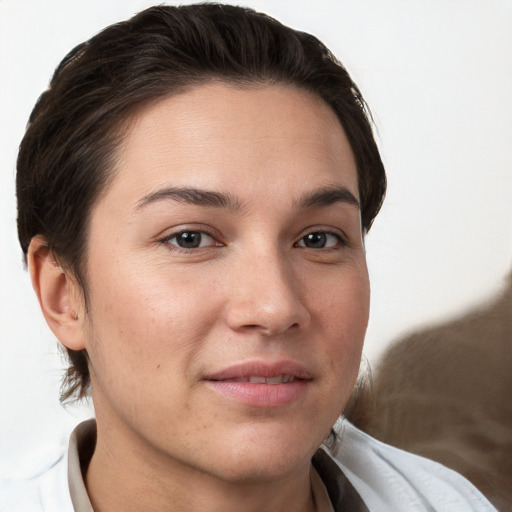 Joyful white young-adult female with short  brown hair and brown eyes