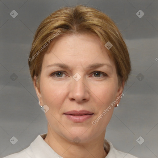 Joyful white adult female with short  brown hair and brown eyes