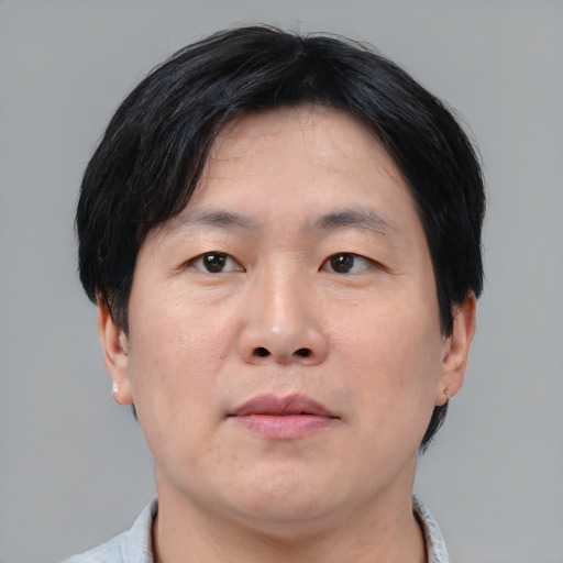 Neutral asian adult male with short  black hair and brown eyes