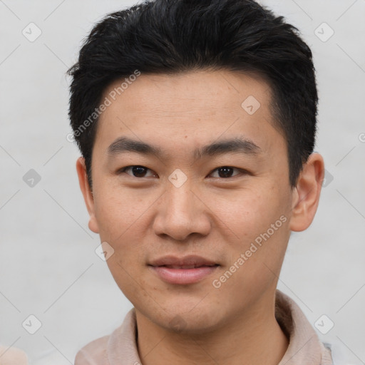 Joyful asian young-adult male with short  brown hair and brown eyes