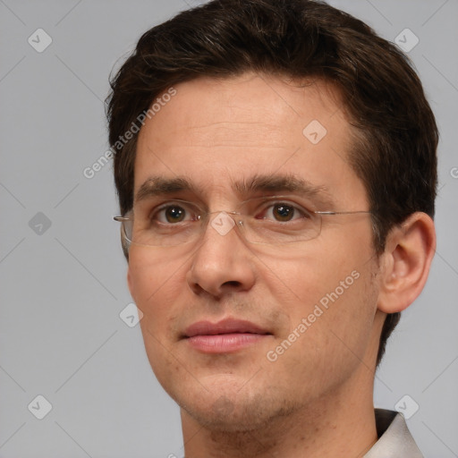 Joyful white adult male with short  brown hair and brown eyes