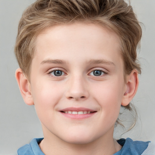 Joyful white child female with short  brown hair and blue eyes