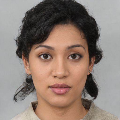 Neutral latino young-adult female with medium  brown hair and brown eyes