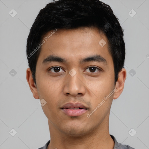 Neutral latino young-adult male with short  black hair and brown eyes