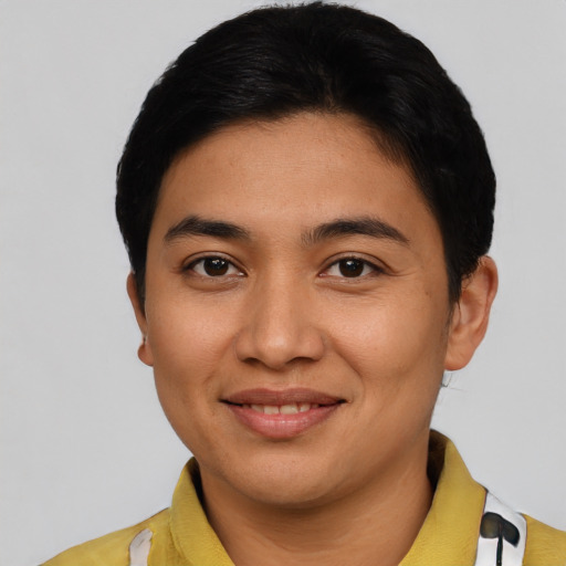 Joyful asian young-adult female with short  black hair and brown eyes
