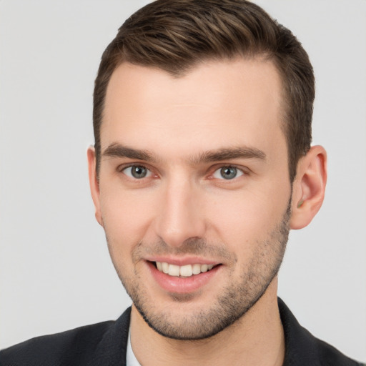 Joyful white young-adult male with short  brown hair and brown eyes