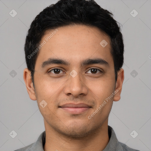 Joyful latino young-adult male with short  black hair and brown eyes