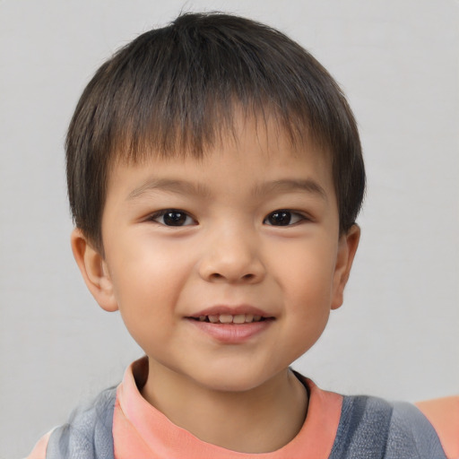 Joyful white child male with short  brown hair and brown eyes