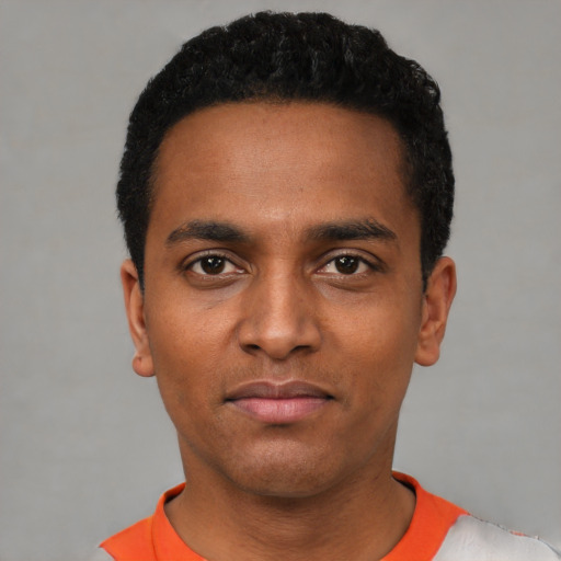 Neutral black young-adult male with short  black hair and brown eyes