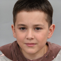 Joyful white child male with short  brown hair and grey eyes