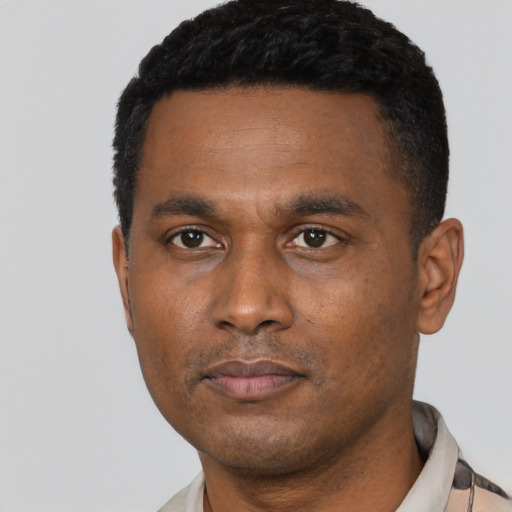 Neutral black young-adult male with short  black hair and brown eyes
