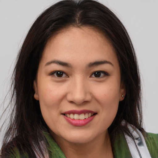 Joyful white young-adult female with long  brown hair and brown eyes