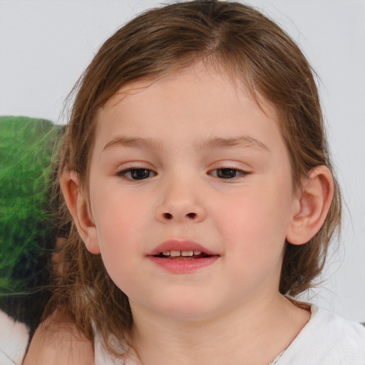 Joyful white child female with medium  brown hair and brown eyes