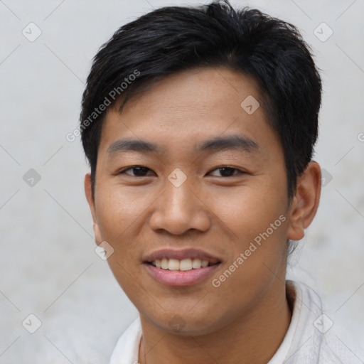 Joyful asian young-adult male with short  black hair and brown eyes