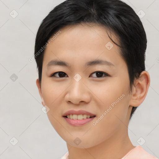 Joyful asian young-adult female with short  brown hair and brown eyes