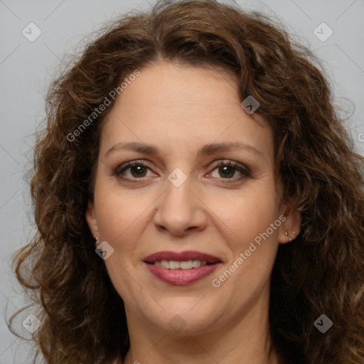 Joyful white adult female with long  brown hair and brown eyes