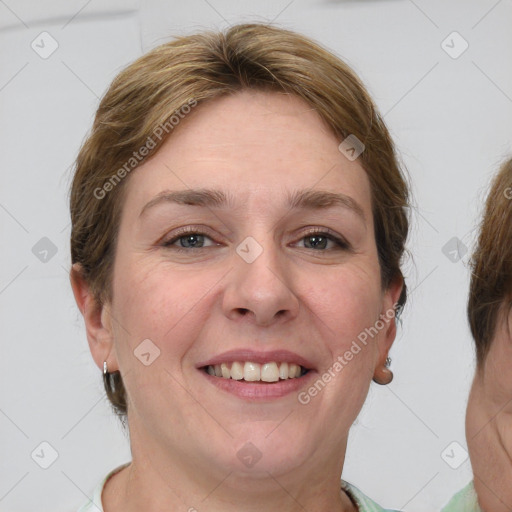 Joyful white adult female with medium  brown hair and grey eyes