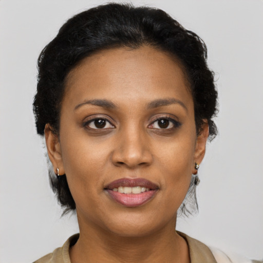 Joyful black young-adult female with short  brown hair and brown eyes
