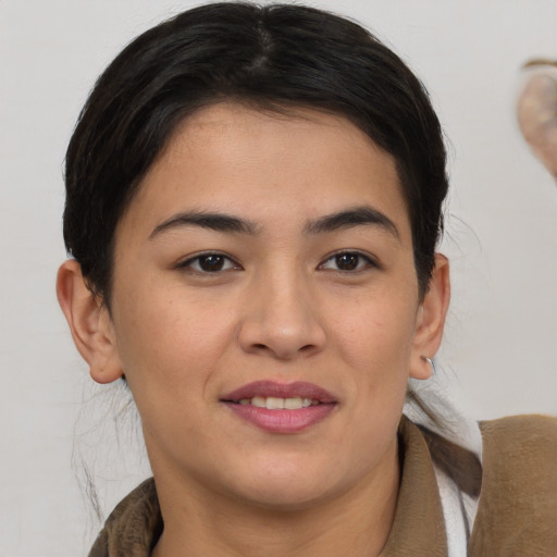 Joyful white young-adult female with medium  brown hair and brown eyes