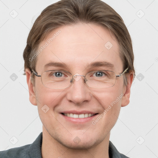 Joyful white adult male with short  brown hair and grey eyes