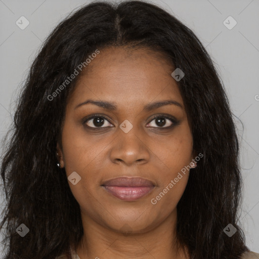 Joyful black young-adult female with long  brown hair and brown eyes