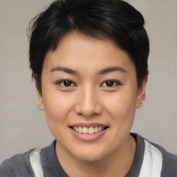 Joyful asian young-adult female with short  brown hair and brown eyes