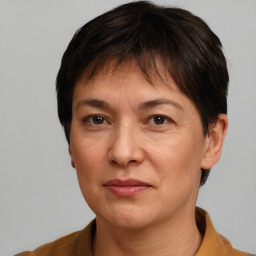 Joyful white adult female with short  brown hair and brown eyes