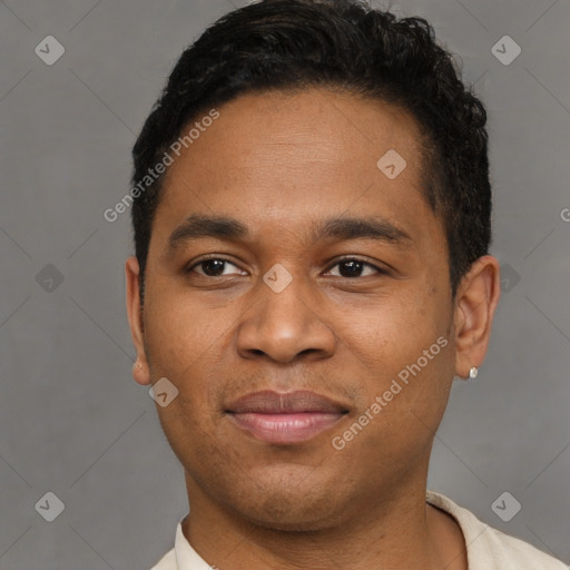 Joyful latino young-adult male with short  brown hair and brown eyes