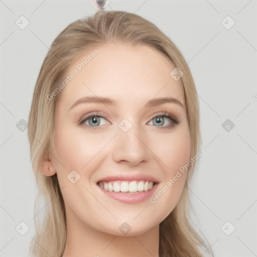 Joyful white young-adult female with long  brown hair and blue eyes