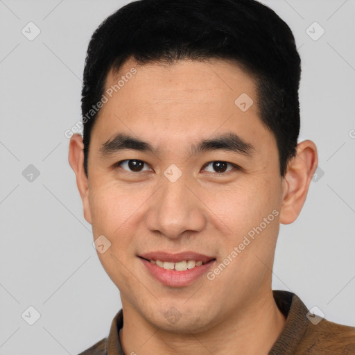 Joyful white young-adult male with short  black hair and brown eyes