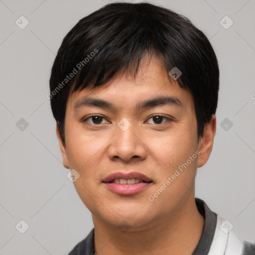 Joyful asian young-adult male with short  black hair and brown eyes