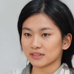 Joyful asian young-adult female with medium  black hair and brown eyes