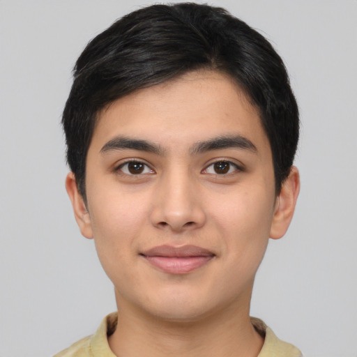 Joyful asian young-adult male with short  black hair and brown eyes