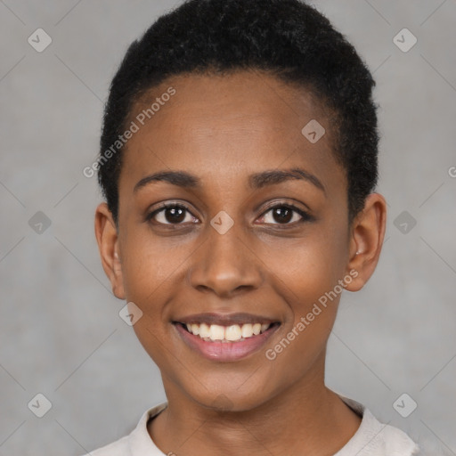 Joyful black young-adult female with short  black hair and brown eyes