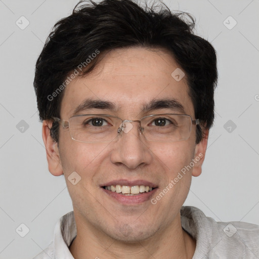 Joyful white adult male with short  black hair and brown eyes