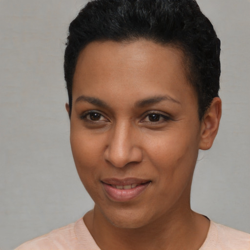 Joyful latino young-adult female with short  brown hair and brown eyes
