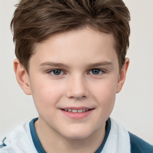 Joyful white child male with short  brown hair and grey eyes