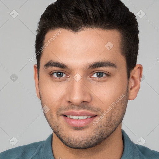 Joyful white young-adult male with short  brown hair and brown eyes