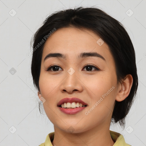 Joyful asian young-adult female with medium  black hair and brown eyes