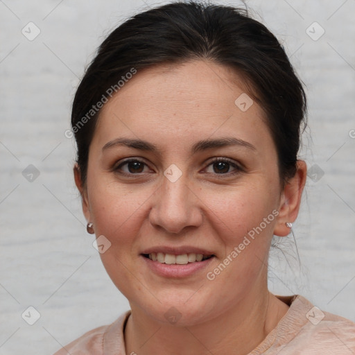 Joyful white adult female with short  brown hair and brown eyes